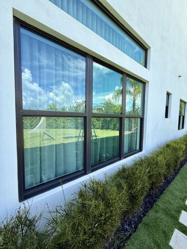 The same window and wall clean after exterior cleaning